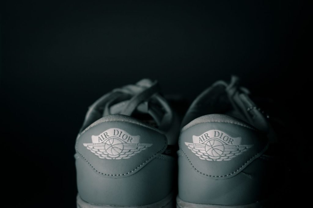 Elegant close-up of Air Dior sneakers, showcasing luxury branding and style.
