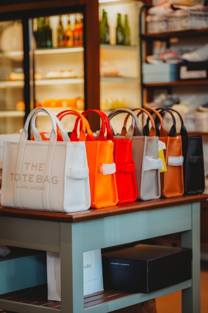 Vibrant handbags on display in a chic Ankara retail store. Perfect for fashion enthusiasts.